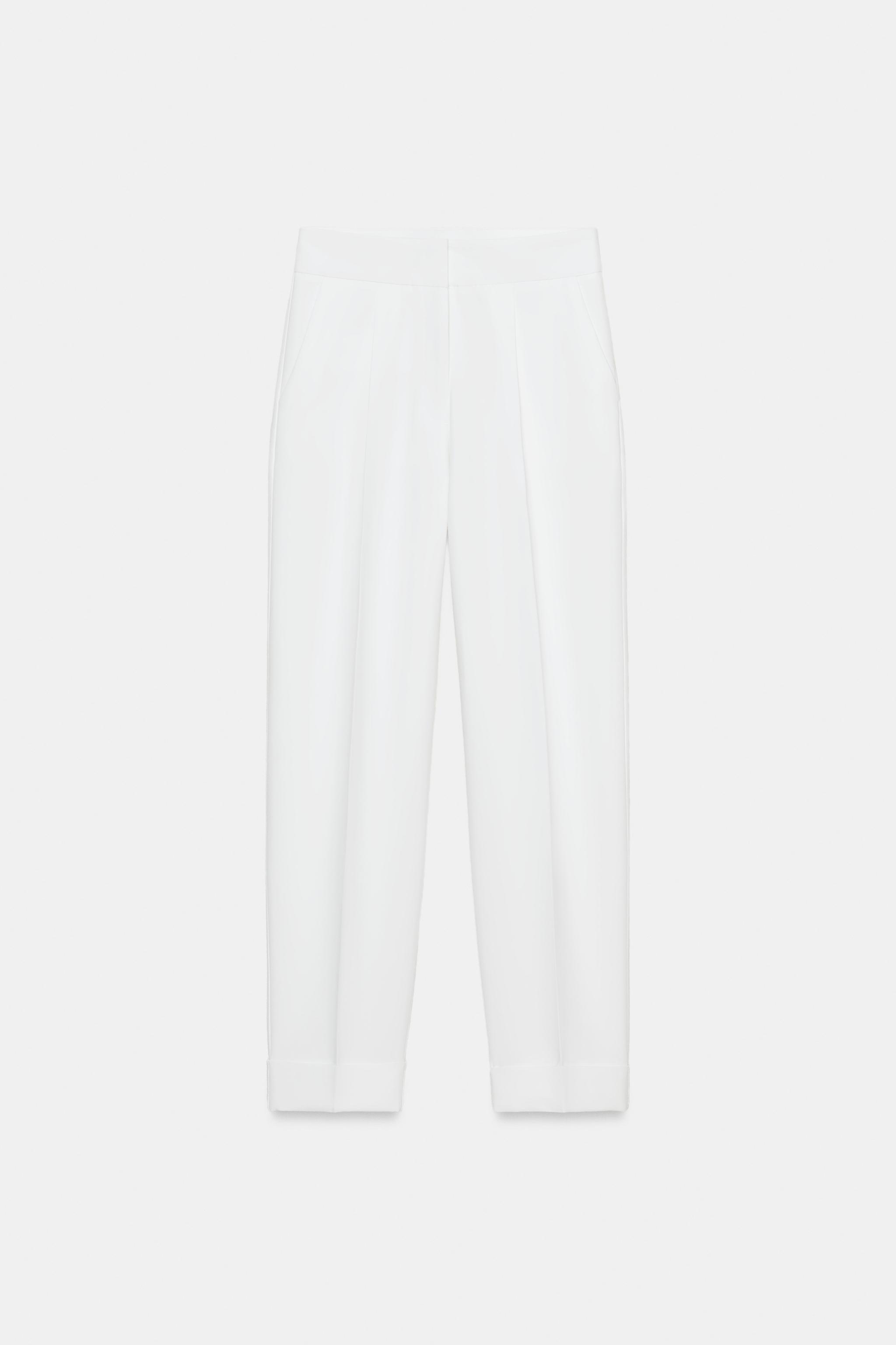 PANTALON À PLIS ET BAS REVERS